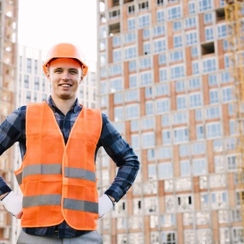 front view smiley man with hands hips front view smiley man with hands hips