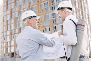 side view people with building sketch